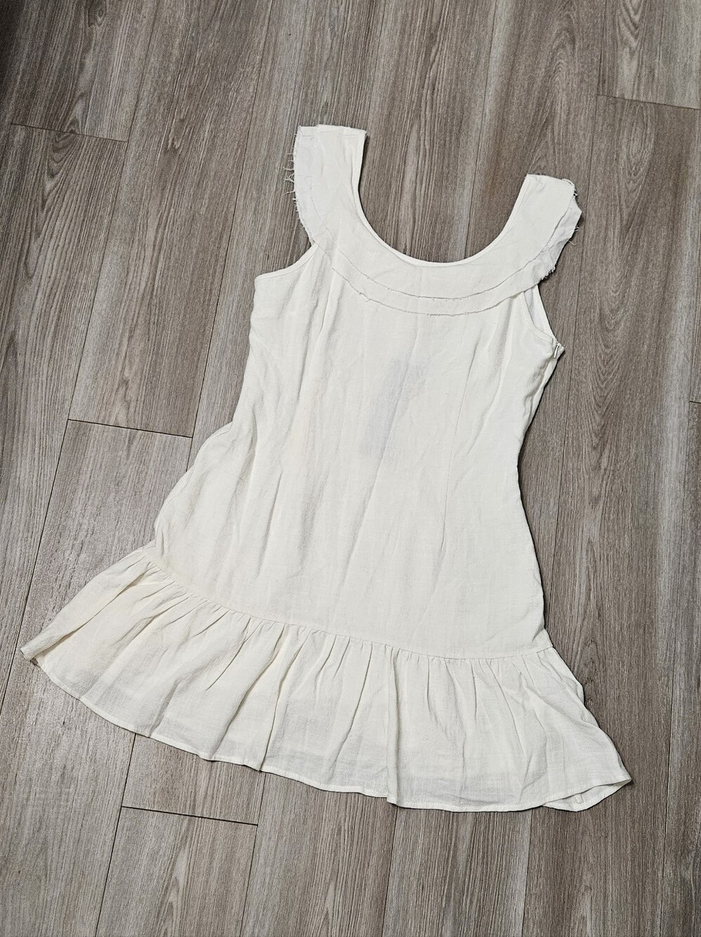 Sleeveless Ruffle-Hem Mini Dress in Cream